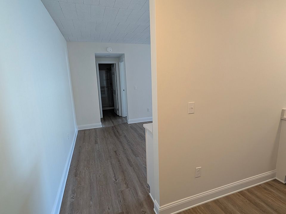 View from apartment entry toward bedroom/bathroom hall