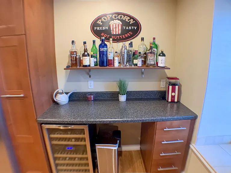 Bar area and cabinet area is perfect for mixing drinks or prepping food.
