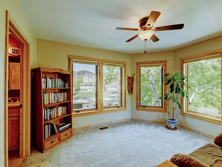 Many large windows with beautiful aspens providing privacy and shade. Best room in the house!