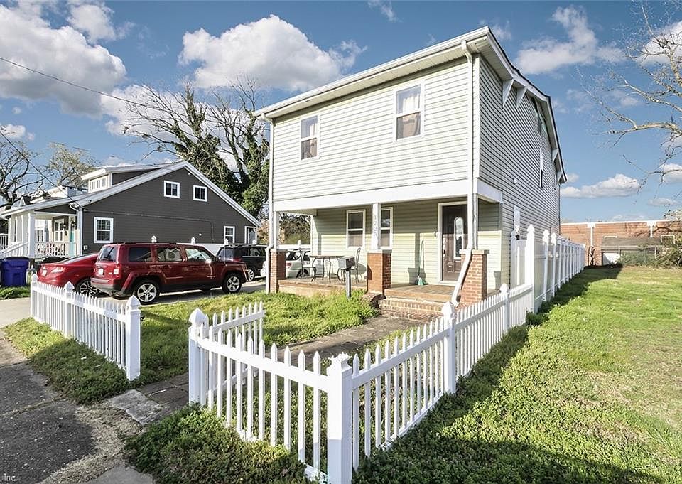 Front with 4 car driveway