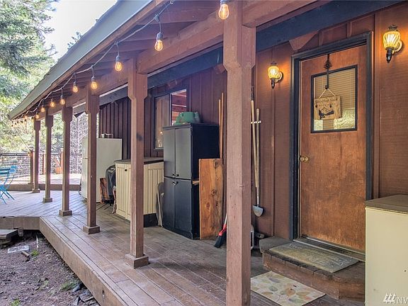 Covered walk way that leads to both entrances to the house. The one seen here in the picture and the other further down on the large deck that has a spectacular view of the property.