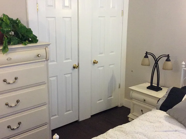 Third bedroom showing two closet doors.
