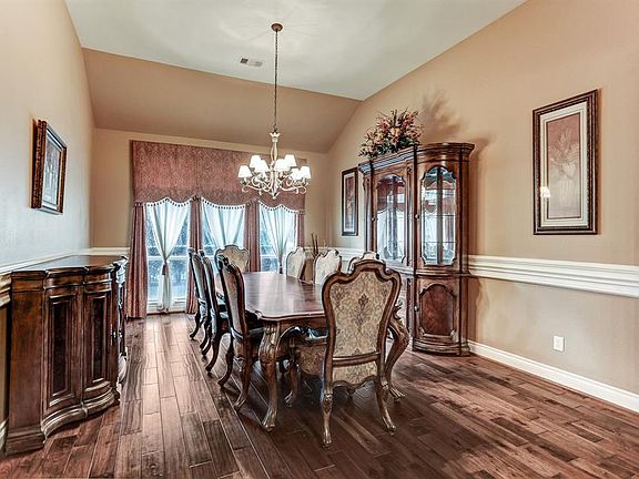 Large elegant formal dining boasts so much character and detail with the 3 piece chair rail molding.