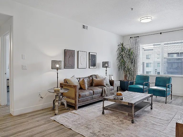 Bright living room with open layout and large windows.