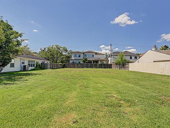 Large deep lot located in the middle of Maple Street in Bellaire.