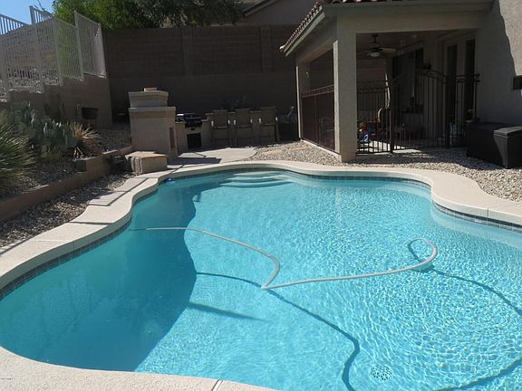 backyard with pool, bbq, bar, foreplace