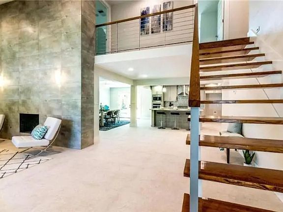 huge, lofted living area with kitchen, dining, fireplace