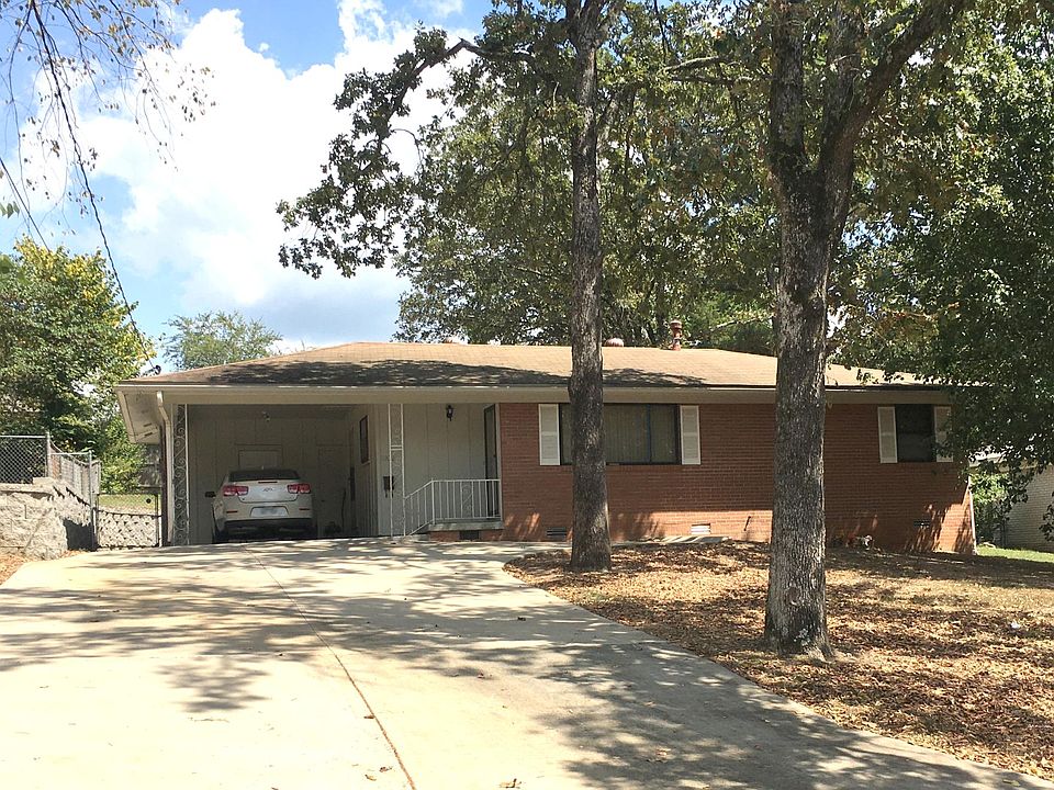 Front of House. New extended driveway and retaining wall. Video available upon request.