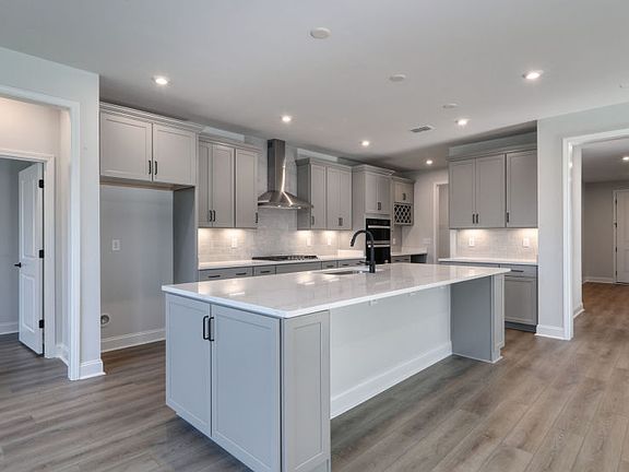 Open Kitchen with an oversized island perfect for additional seating opportunities and storage