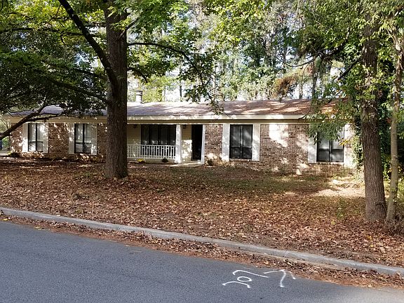 Large, shaded front yard
