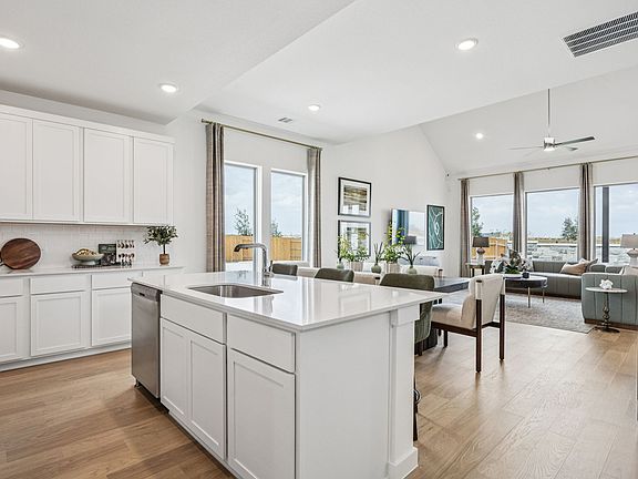 Kitchen in the Trinity home plan by Trophy Signature Homes - REPRESENTATIVE PHOTO