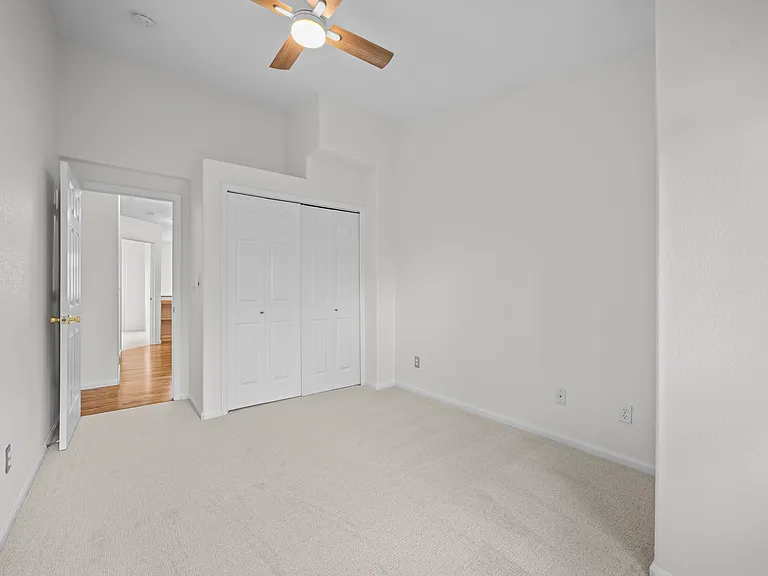 Bedroom #2. Bifold closet doors. Vaulted ceiling.