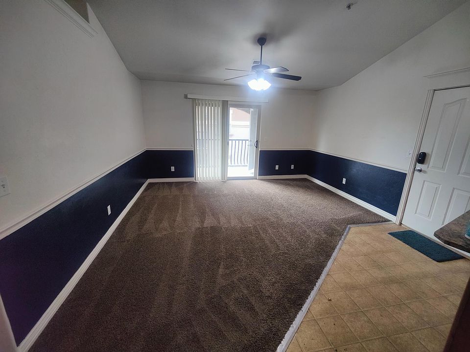 Spacious front room, vaulted ceilings, and kitchen.