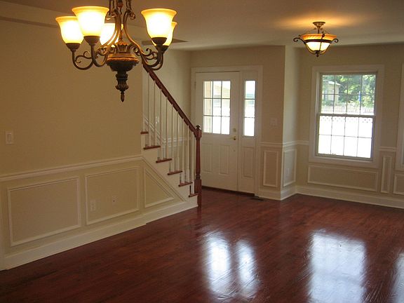 Entryway - Gleaming hardwood floors and beautiful molding throughout!