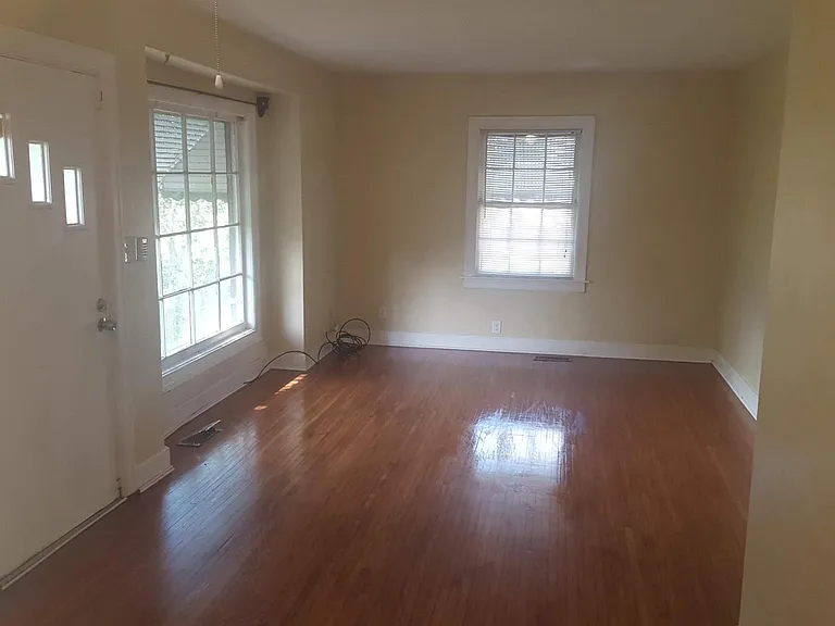 New photos of Living room and giant front window.