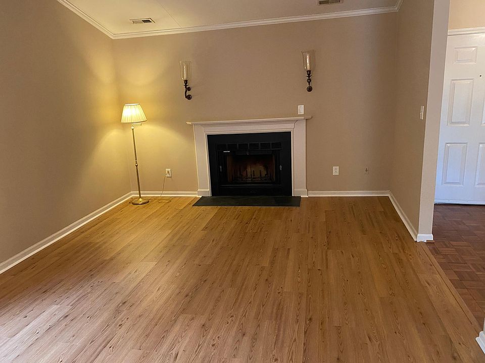 Family room has cathedral ceilings and a wood burning fireplace.