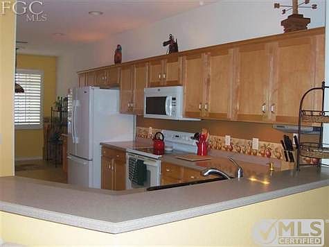 Kitchen with upgraded cabinets and corian counters