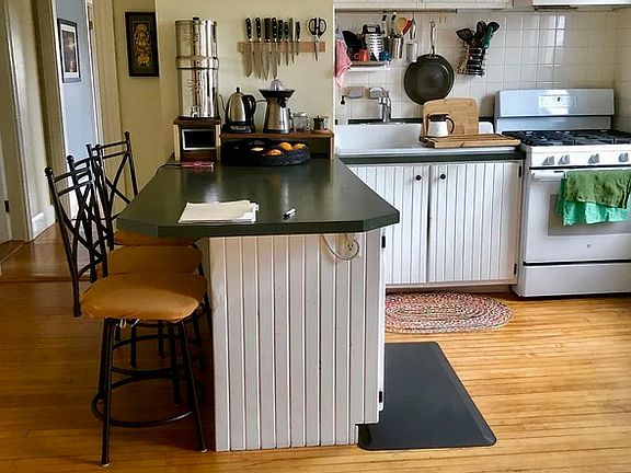 Similar kitchen, (cabinets are wood stain and new countertops coming in)