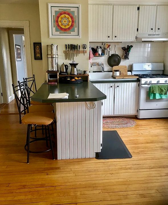 Similar kitchen, (cabinets are wood stain and new countertops coming in)
