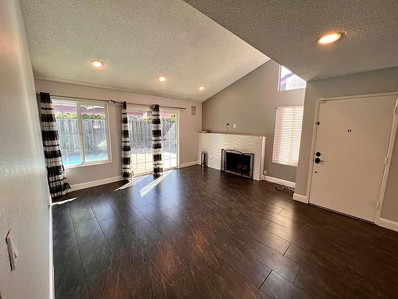 Living Room w/ wood Fire Place