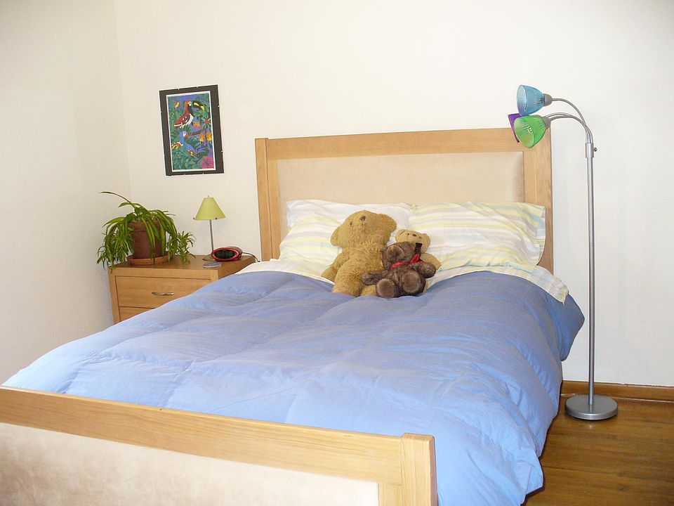 Bedrooms have ceiling fans and hardwood floors