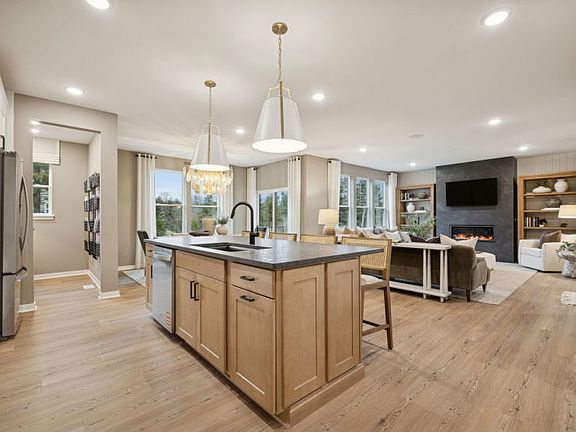 A chef s dream kitchen with sleek appliances, a spacious island, and elegant finishes.