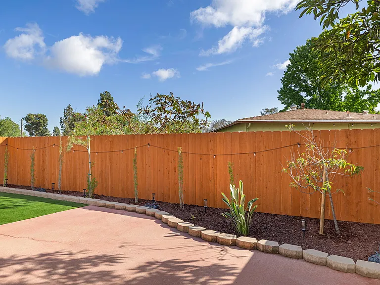 Complemented with beautifully landscaped tress and plants.