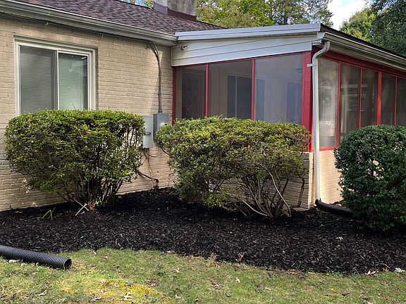 Back of house showing screened in back porch
