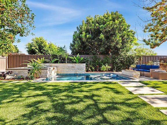 Pool, spa, waterfalls,poolside built-in gas fire pit, koi pond, hook ups for bbq & pizza oven, farm to table garden, market lights, huge trees, sun deck, shade cover....The outside lover & entertainers dream!