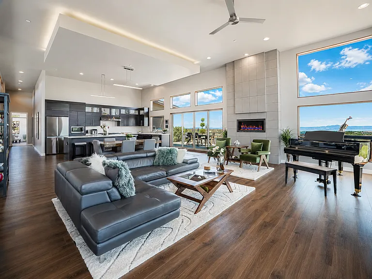 Full View of Great Room with drop down in 13' ceilings that has uplighting. Particularly spectacular at night. UV Film protects you and the furniture on the windows!
