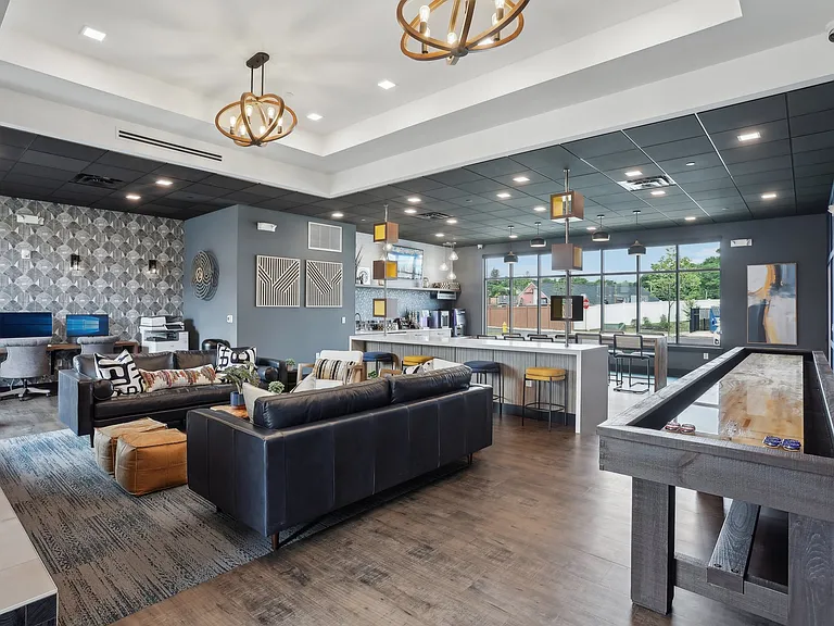 Media lounge with shuffleboard and board games