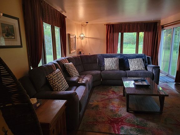 Family room with 65", new recliner, indoor playhouse games airhockey/ping pong