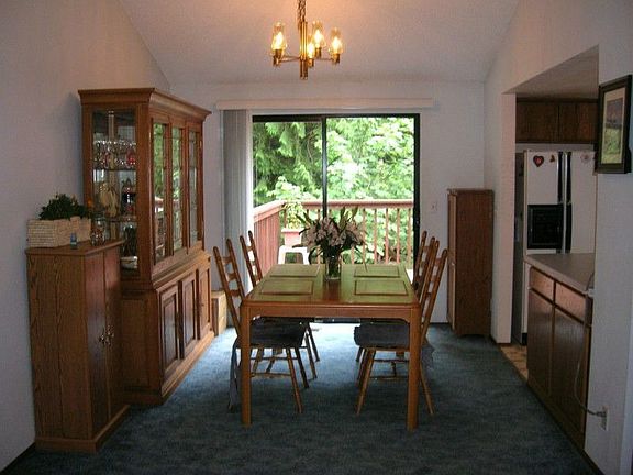 Dining room with slider to huge deck