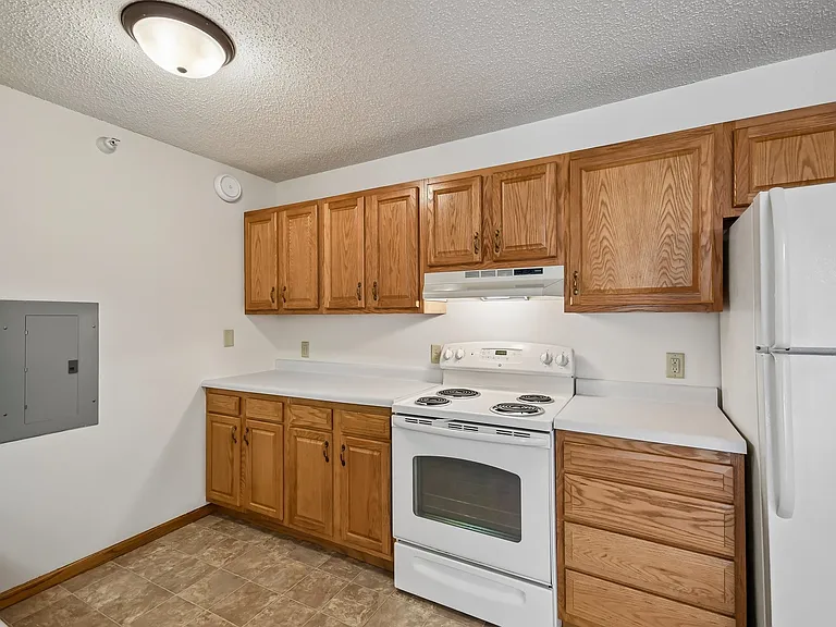 Elevate your lifestyle at Mill Pond Apartments with a modern kitchen featuring sleek finishes and ample storage. Enjoy the convenience and comfort that awaits you. Schedule your tour today and see your future home!