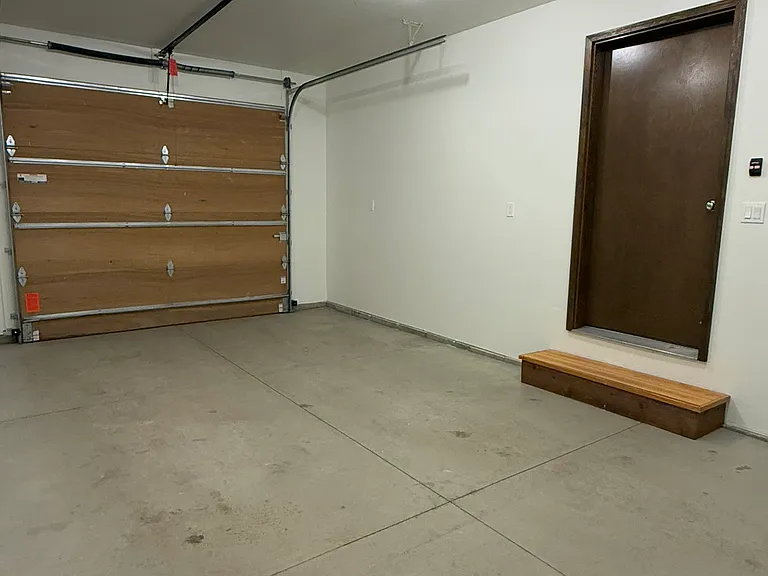 Heated garage with opener.