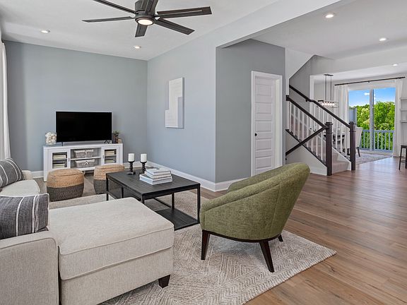 Open main floor living room and kitchen in a DRB Homes Whitaker II model at the Rolling Hills commu