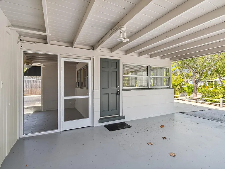 Carport with 2 storage rooms, and washer/dryer hookups