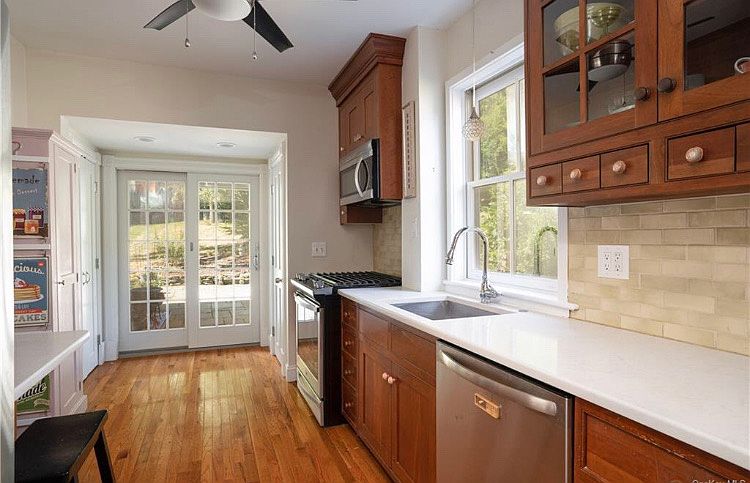 Kitchen with view to garden door. Half bath to the right of the garden door.