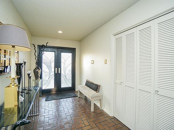 Entry with large storage closet to the right in this photo