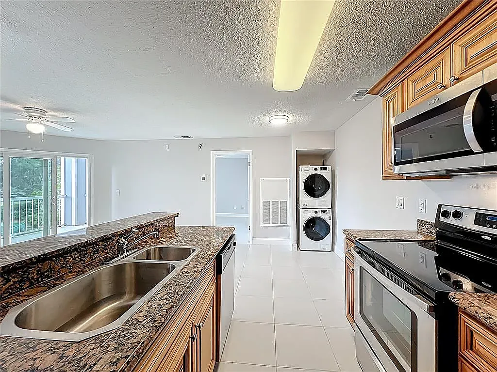 Kitchen/nook/ in-unit washer and dryer - 727 Sugar Bay Way #213