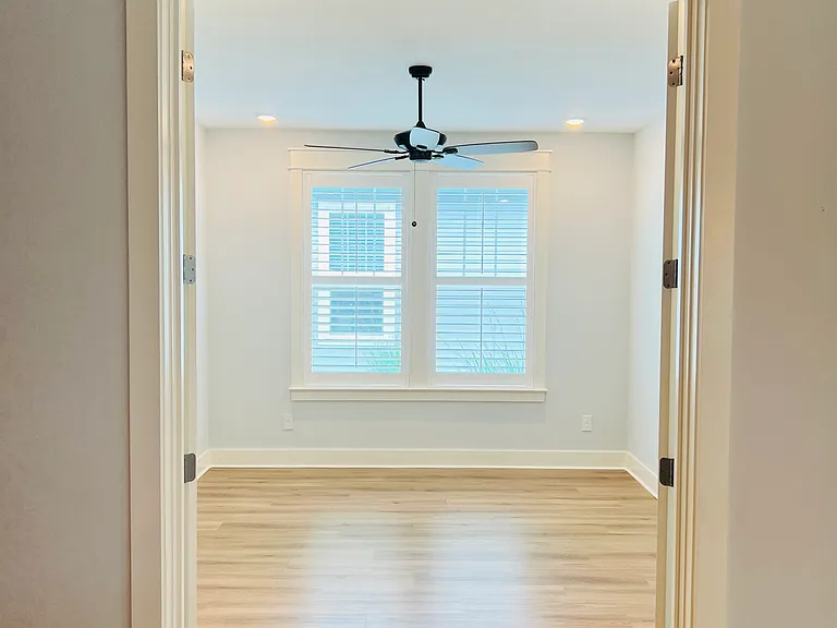 Den with French doors offering flexible extra living space or dining room