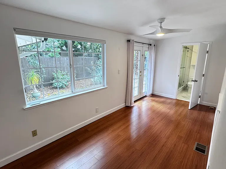 2nd bedroom off Kitchen opens to backyard.