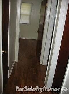 Hallway leading to Bedrooms : Recently refinished Oak Hardwood floors