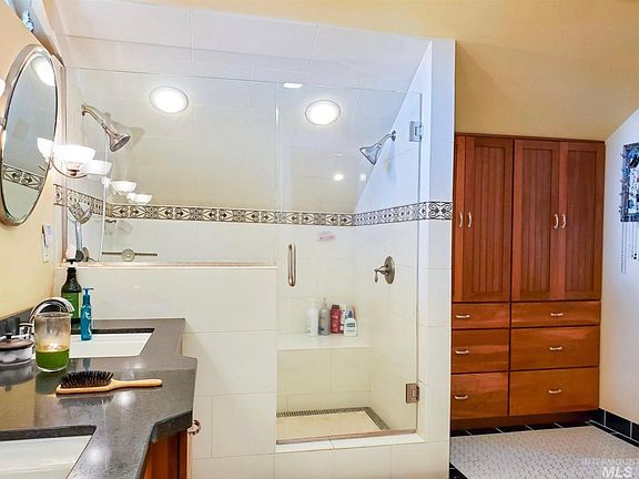 Walk in shower with bench and dual shower heads