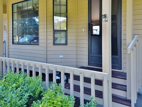 View of front entrance complete with screen door and covered patio