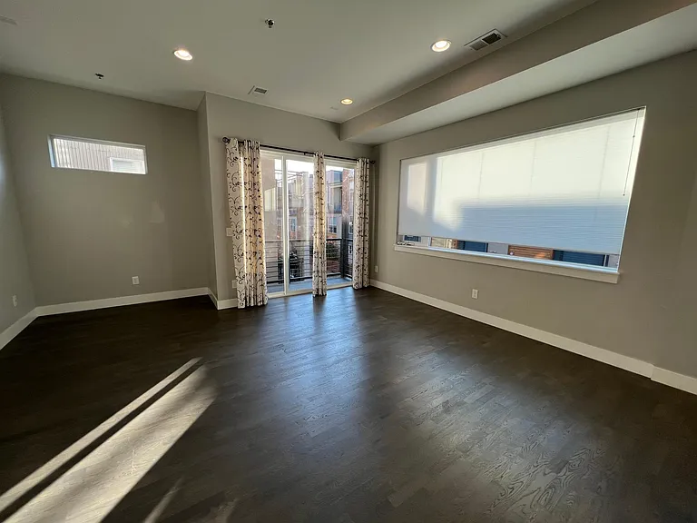 Open living-dining room with a balcony