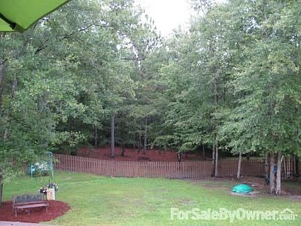 The Backyard
						:
						The property line goes beyond the fence in the back! What a view!