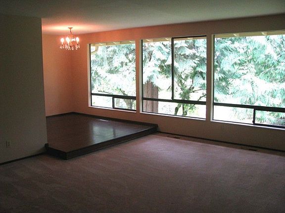 Sunken living room, dining room with recently refinished hardwood floor