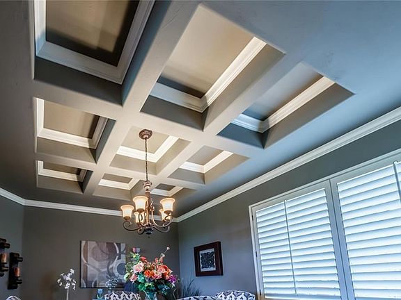 A closer view of the stunning formal room dining ceiling.