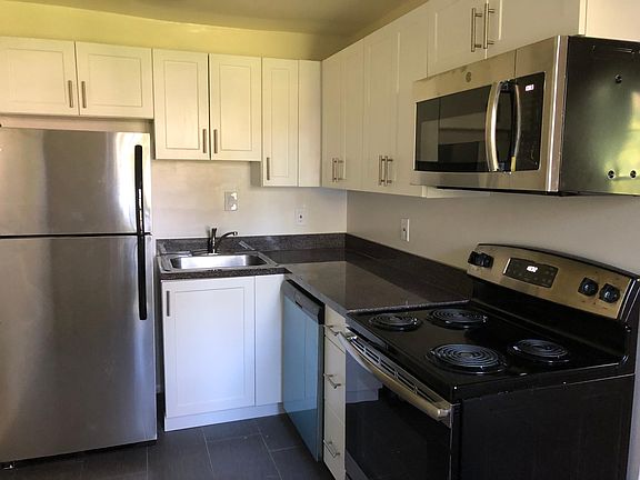 New kitchen with stainless steel appliances.